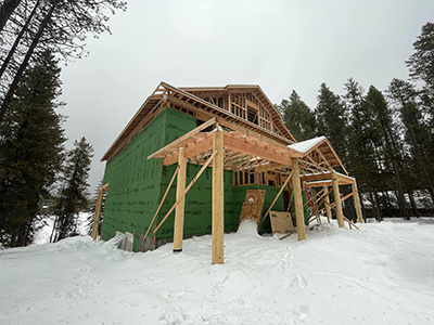 Framing a custom cabin front elevation view in Island Park