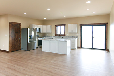 Custom home kitchen with granite countertops and soft-close cabinetry