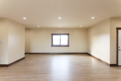 Custom home living space with a large front window