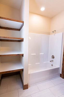 Custom home bathroom with large vanity and bathtub