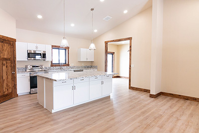 Custom home kitchen with granite countertops and soft-close cabinetry