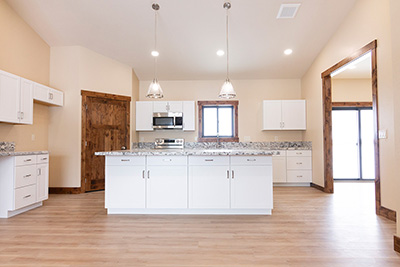 Custom home kitchen with granite countertops and soft-close cabinetry