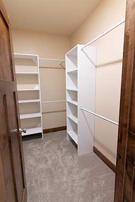Custom home master bedroom suite with walk-in closet