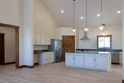 Custom home kitchen with granite countertops and soft-close cabinetry