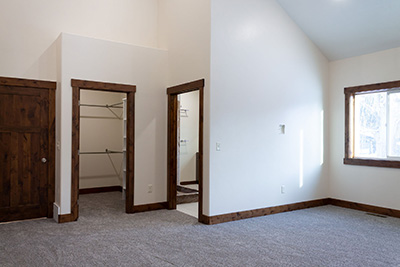 Custom home master bedroom suite with walk-in closet